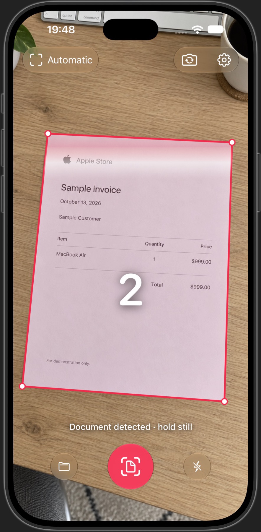 Automatic edge detection and capture on iPhone. Illustrative camera preview with a sample invoice.